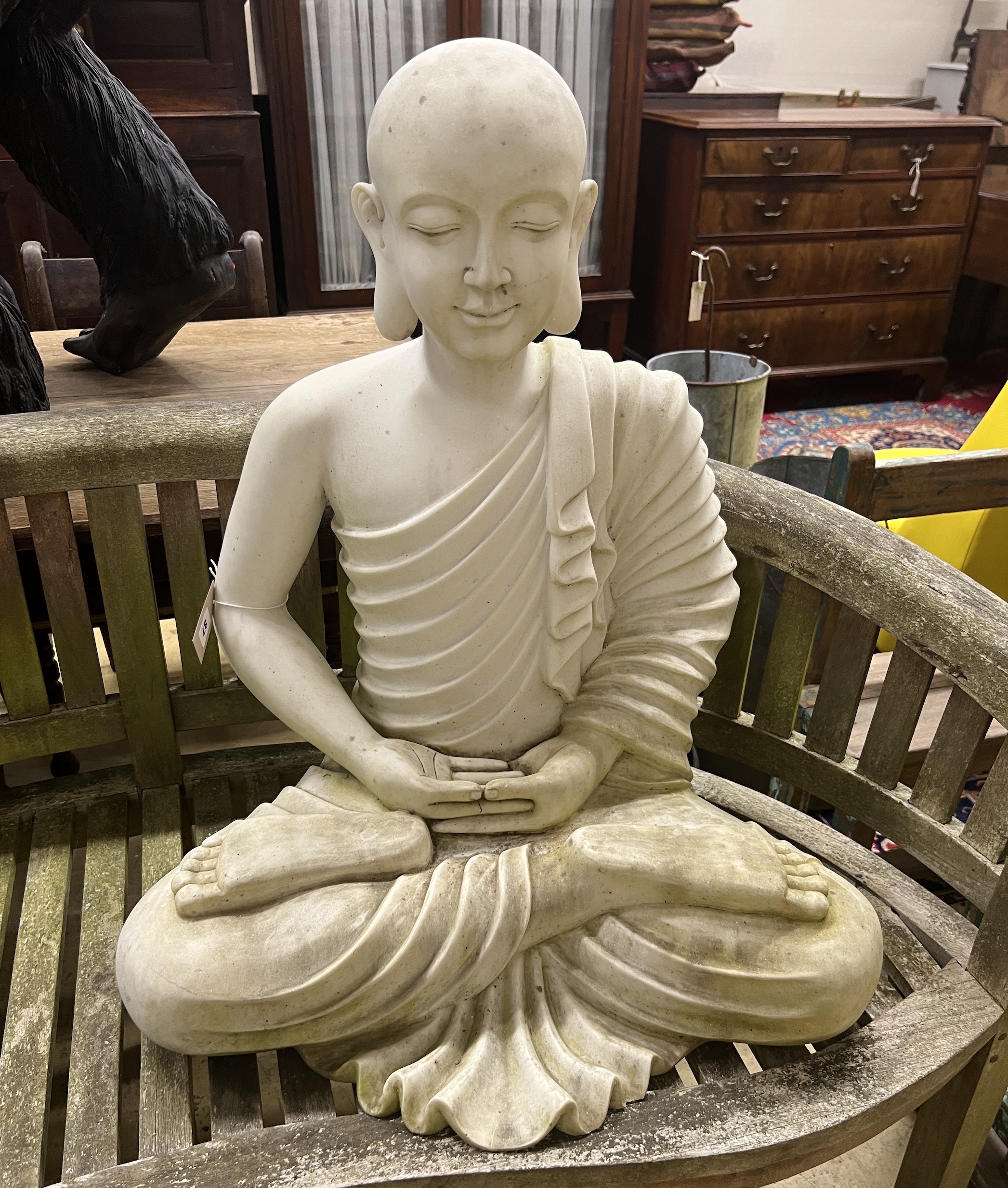 A composition faux marble seated Buddha garden ornament, height 74cm